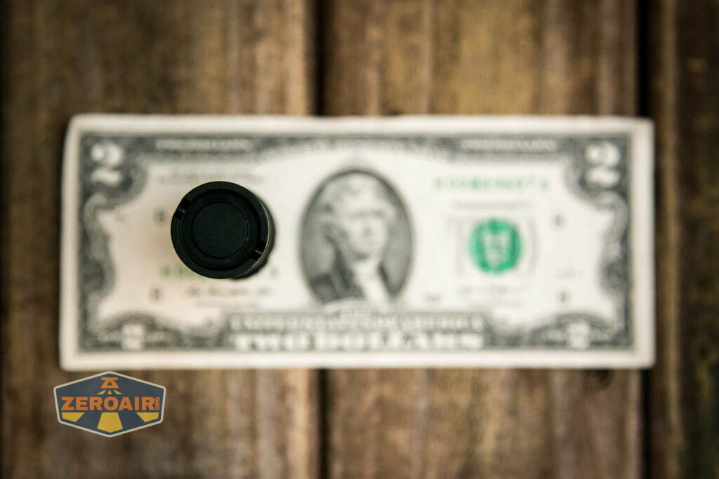 Sofirn SC21 Pro flashlight on two dollar bill