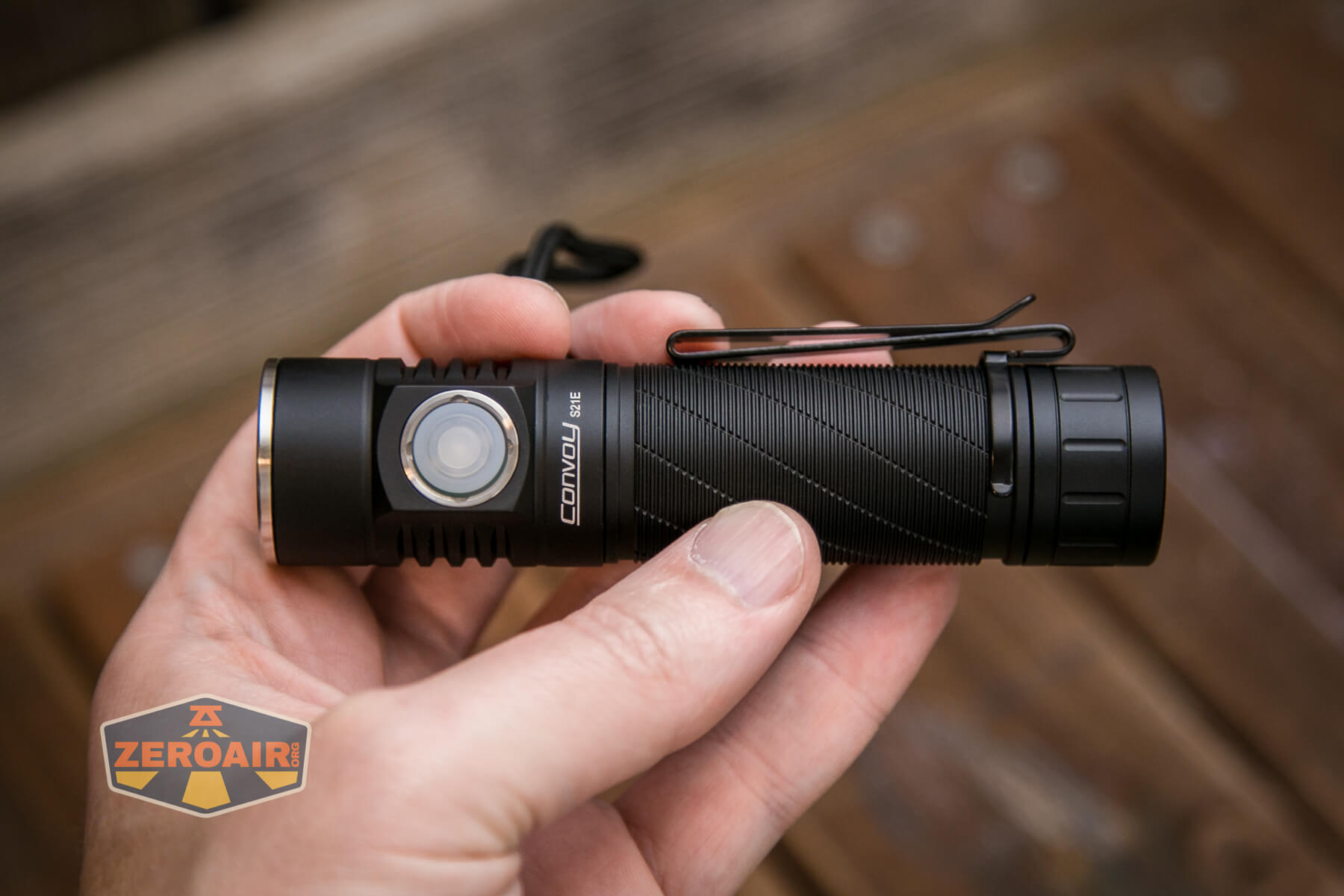 Convoy S21E flashlight in hand