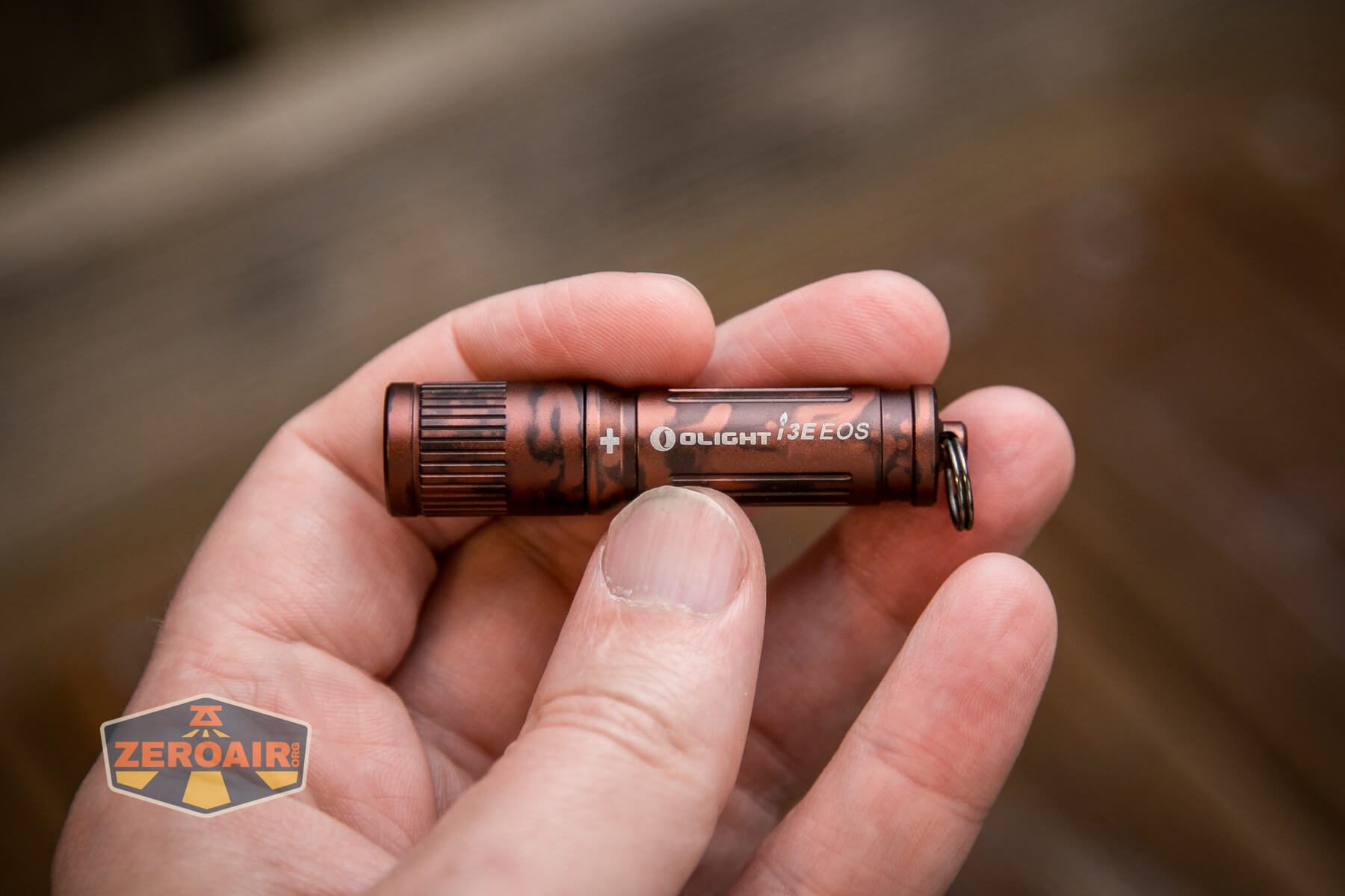 Olight i3E EOS flashlight in hand