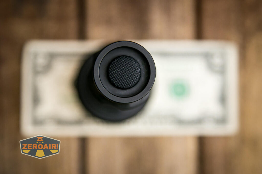 Nightwatch NS59v2 Chaos flashlight on two dollar bill