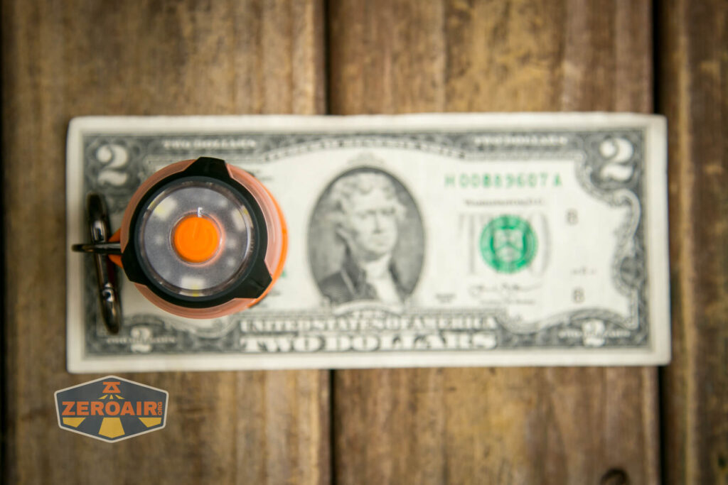 Olight Gober Safety flashlight on two dollar bill