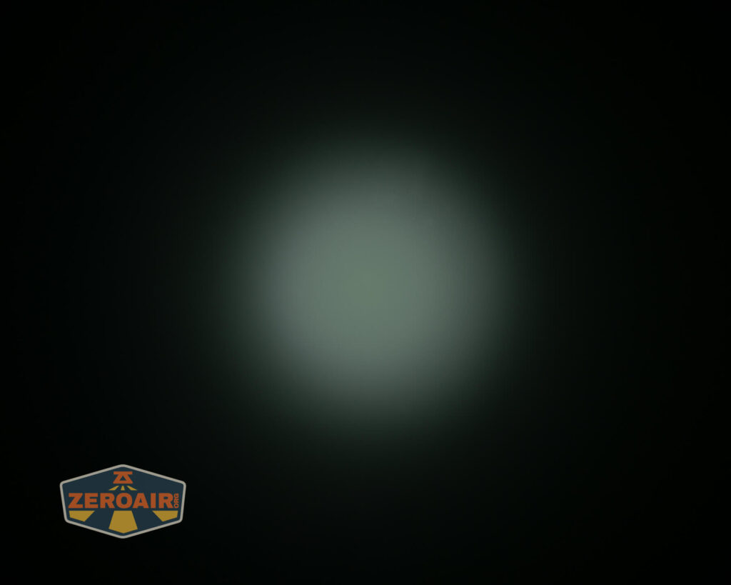 Olight i3E EOS flashlight beamshot on ceiling