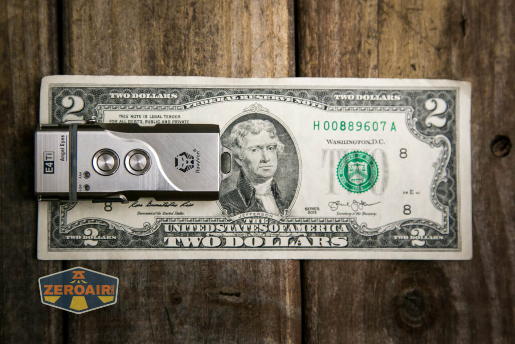 RovyVon Angel Eyes E4Ti flashlight on two dollar bill