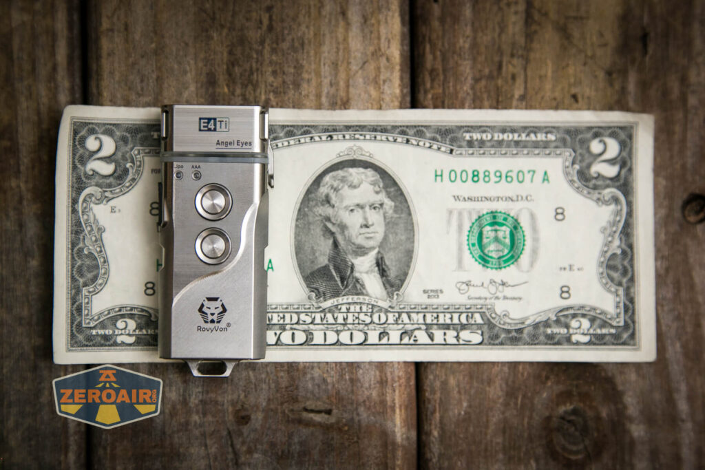 RovyVon Angel Eyes E4Ti flashlight on two dollar bill