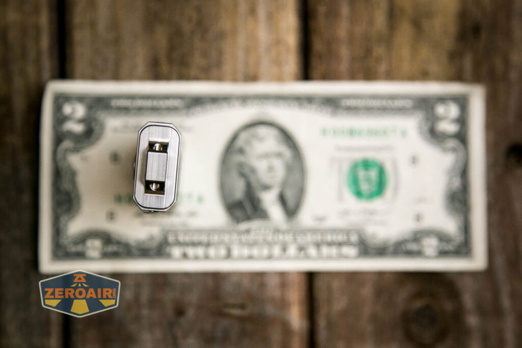 RovyVon Angel Eyes E4Ti flashlight on two dollar bill