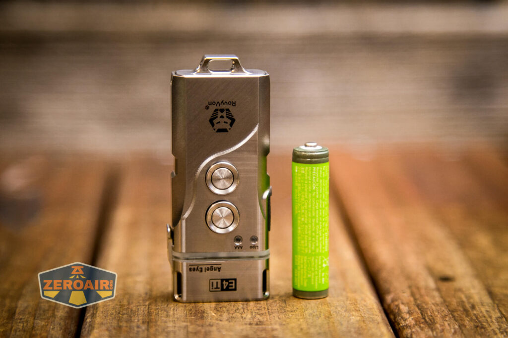 RovyVon Angel Eyes E4Ti flashlight beside AAA cell