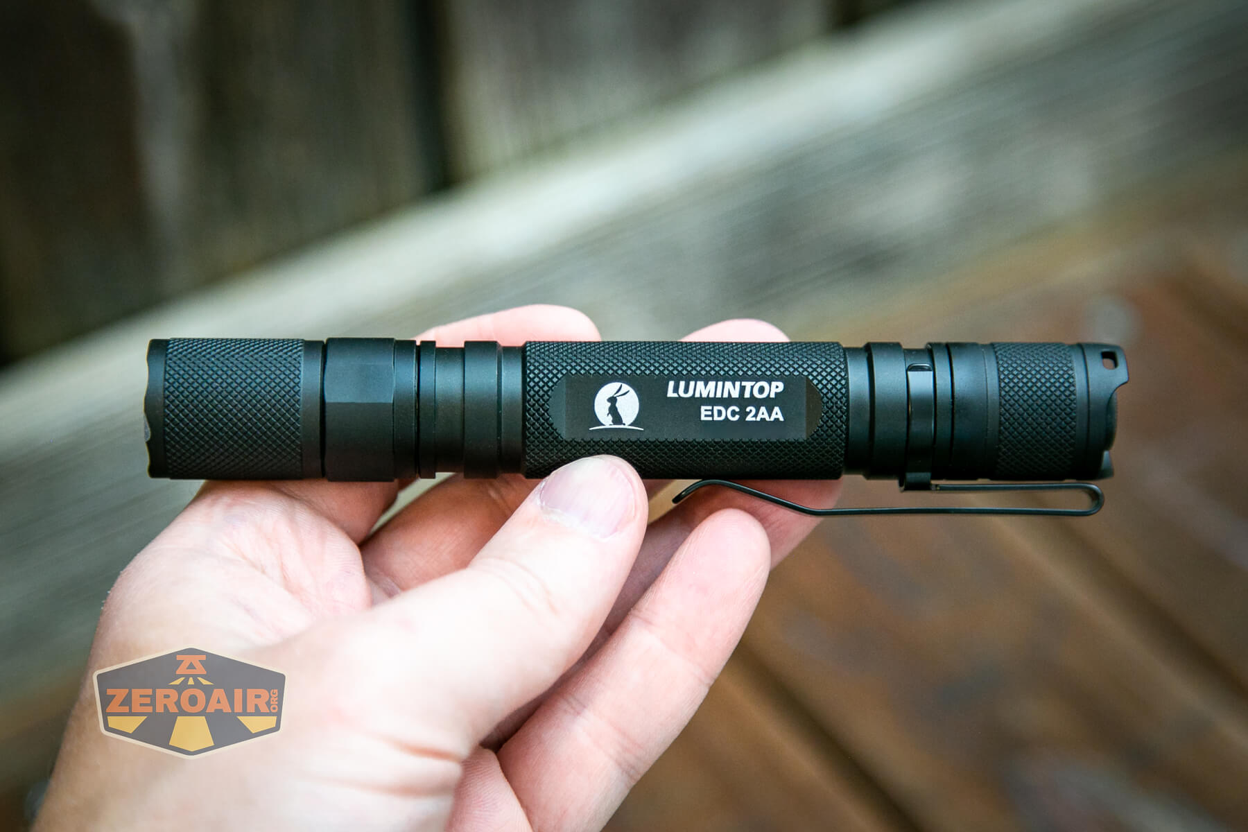 Lumintop EDC 2AA flashlight in hand