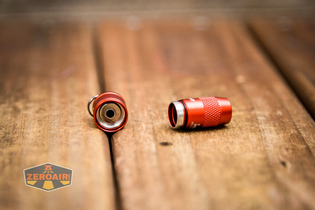 Olight iMini Keychain Flashlight tailcap off showing threads