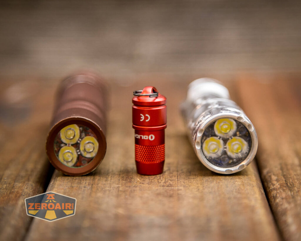 Olight iMini Keychain flashlight beside lights