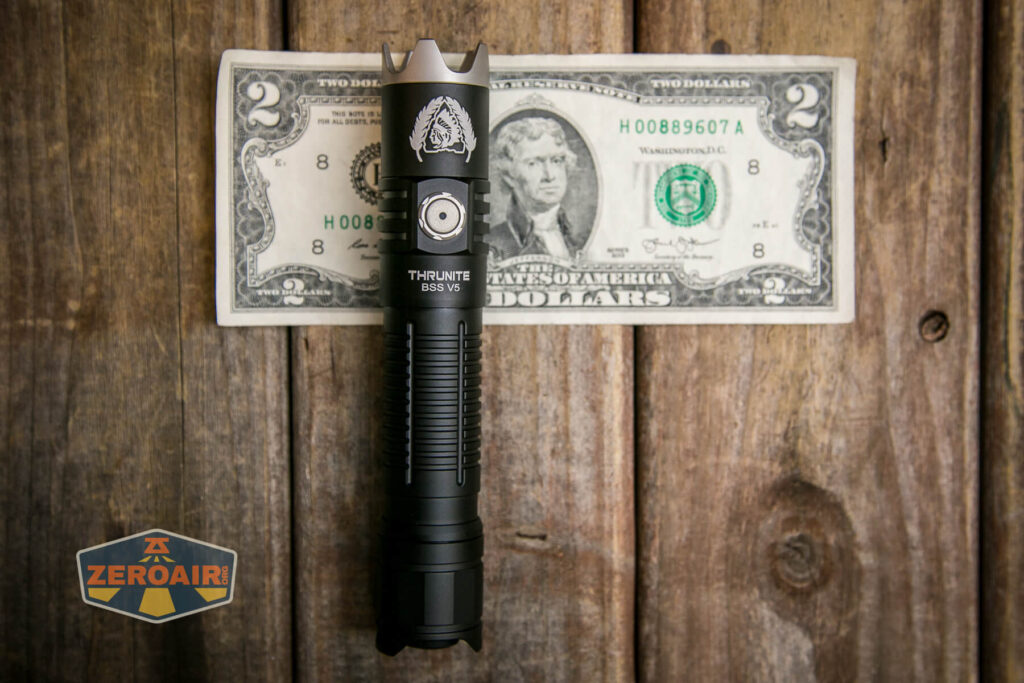 Thrunite BSS V5 flashlight on two dollar bill
