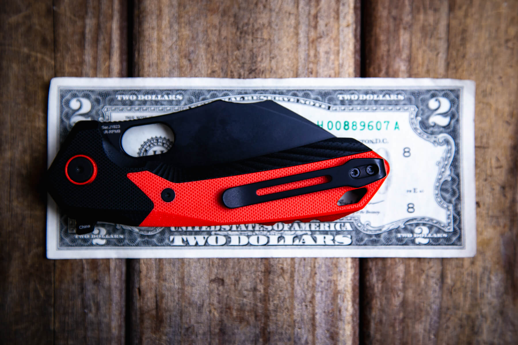 CJRB Caldera G10 knife on a two dollar bill