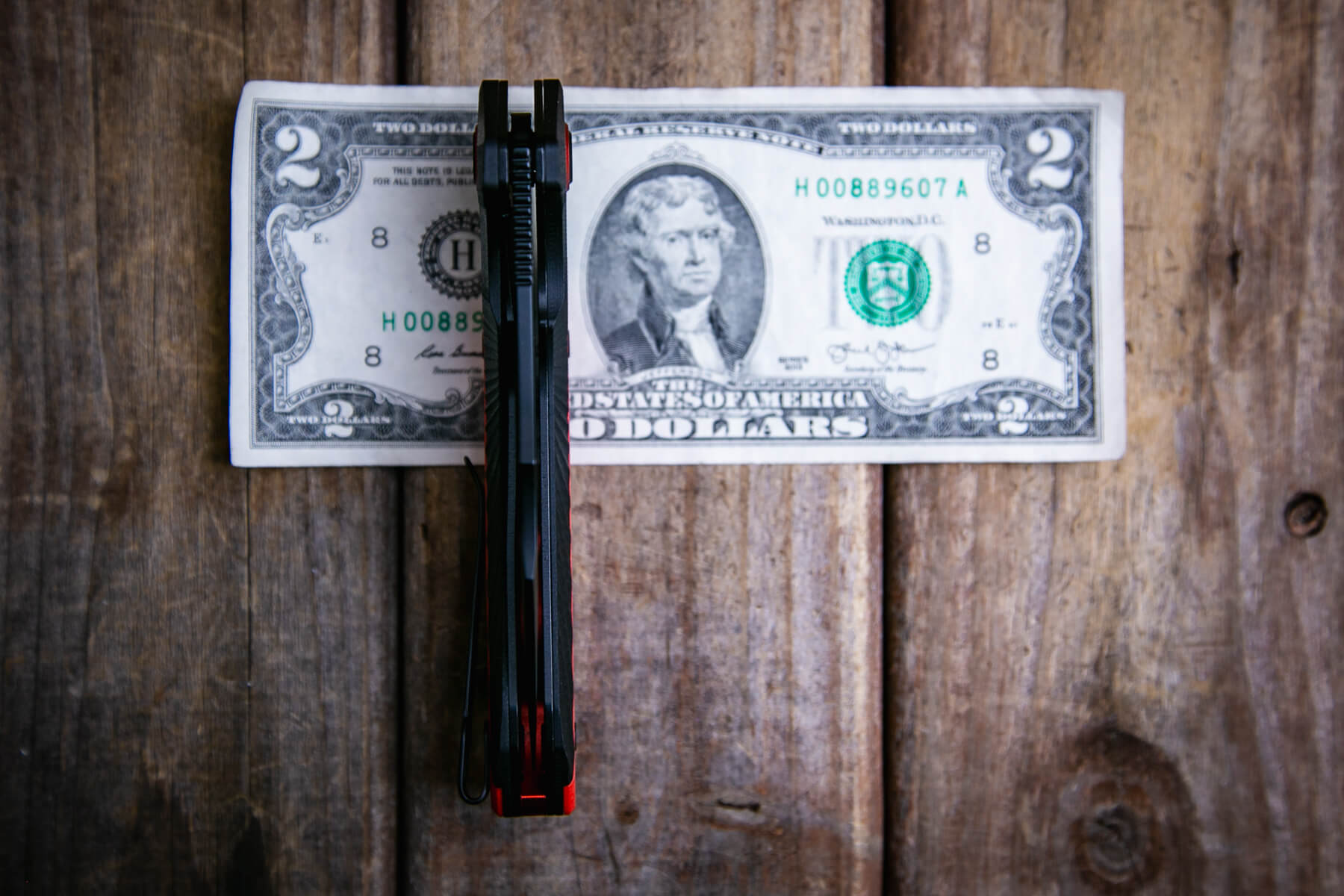 CJRB Caldera G10 knife on a two dollar bill