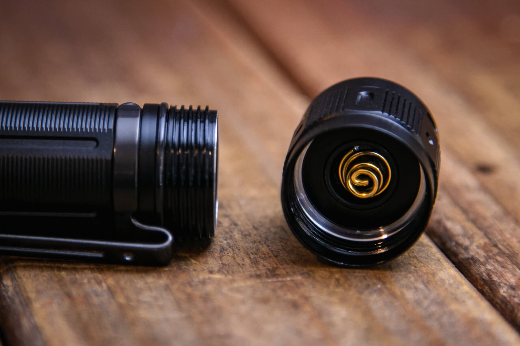 Fenix PD36R Pro rechargeable flashlight tailcap showing spring