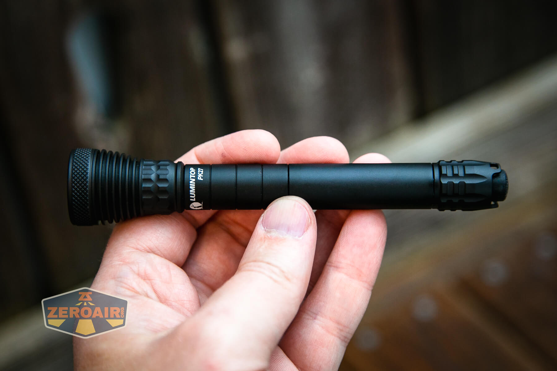 Lumintop PK27 flashlight in hand