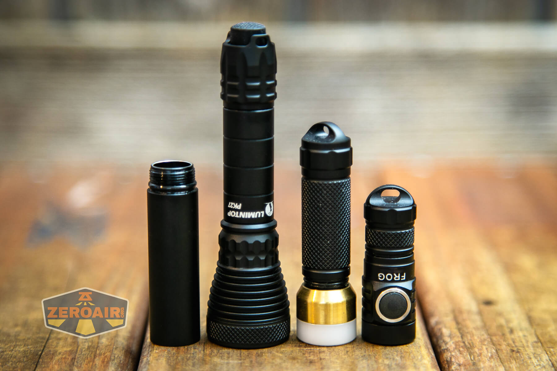 Lumintop PK27 flashlight beside comparables