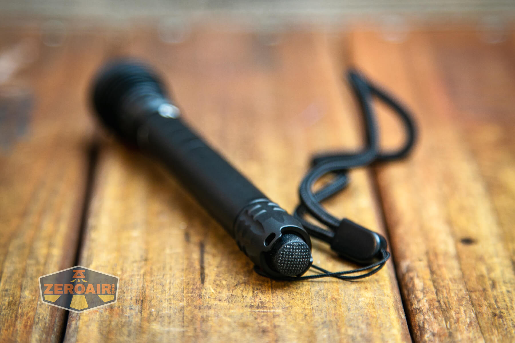 Lumintop PK27 flashlight lanyard installed