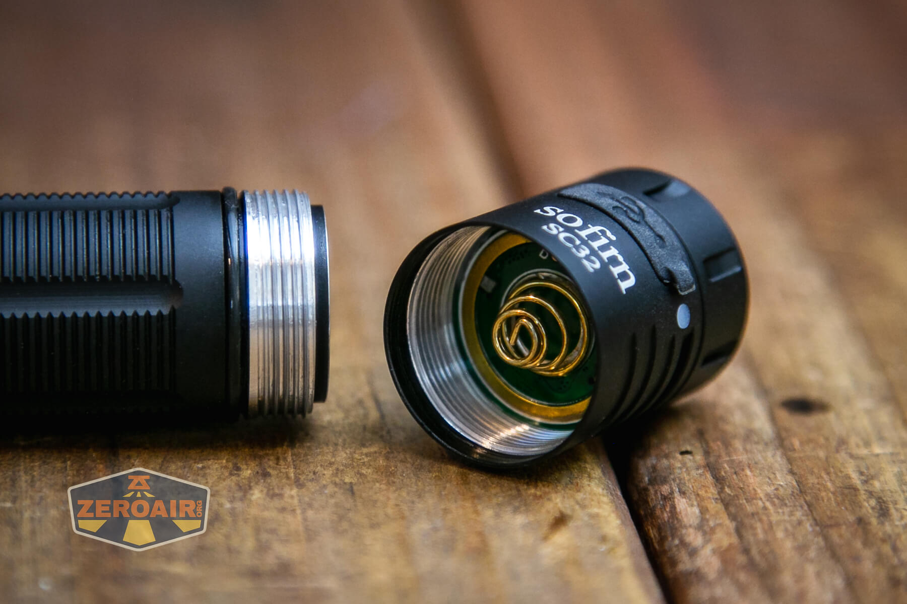 Sofirn SC32 Mini Tactical flashlight showing head contact and threads
