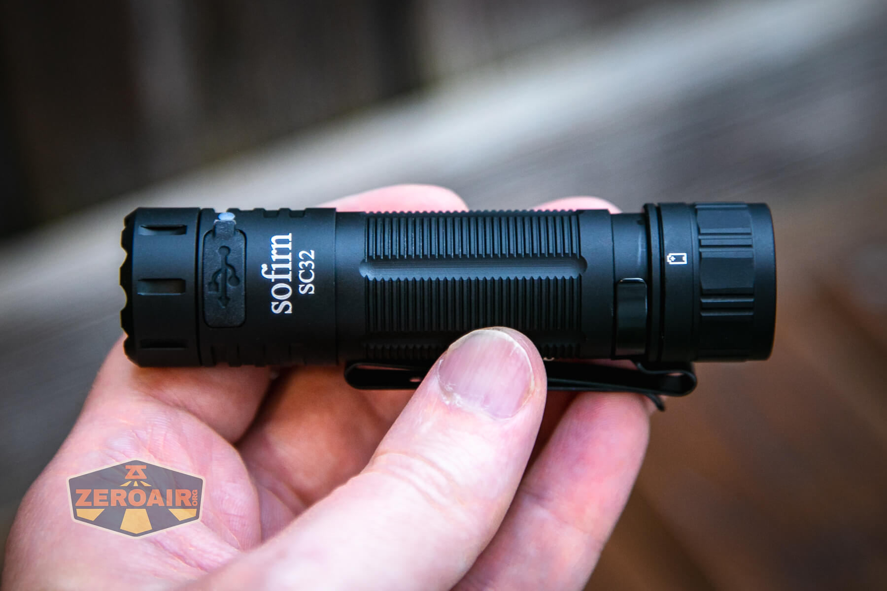 Sofirn SC32 Mini Tactical flashlight in hand
