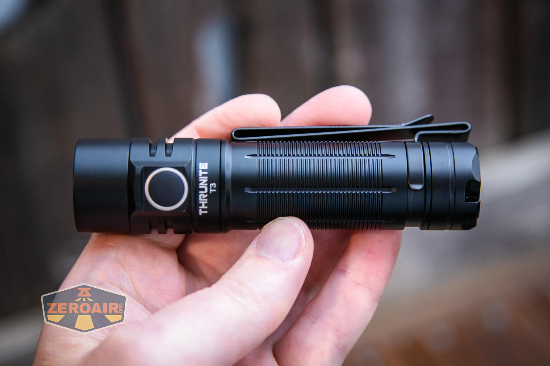 Thrunite T3 thrower flashlight in hand