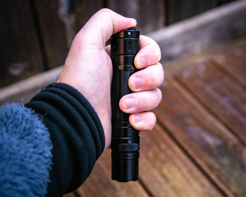 Fenix PD36R Pro rechargeable flashlight in hand