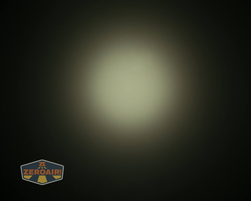 A circular, bright white light appears in the center of a dark background. The light gradually fades outward. In the bottom left corner, there is a ZeroAir logo with an orange and blue color scheme.