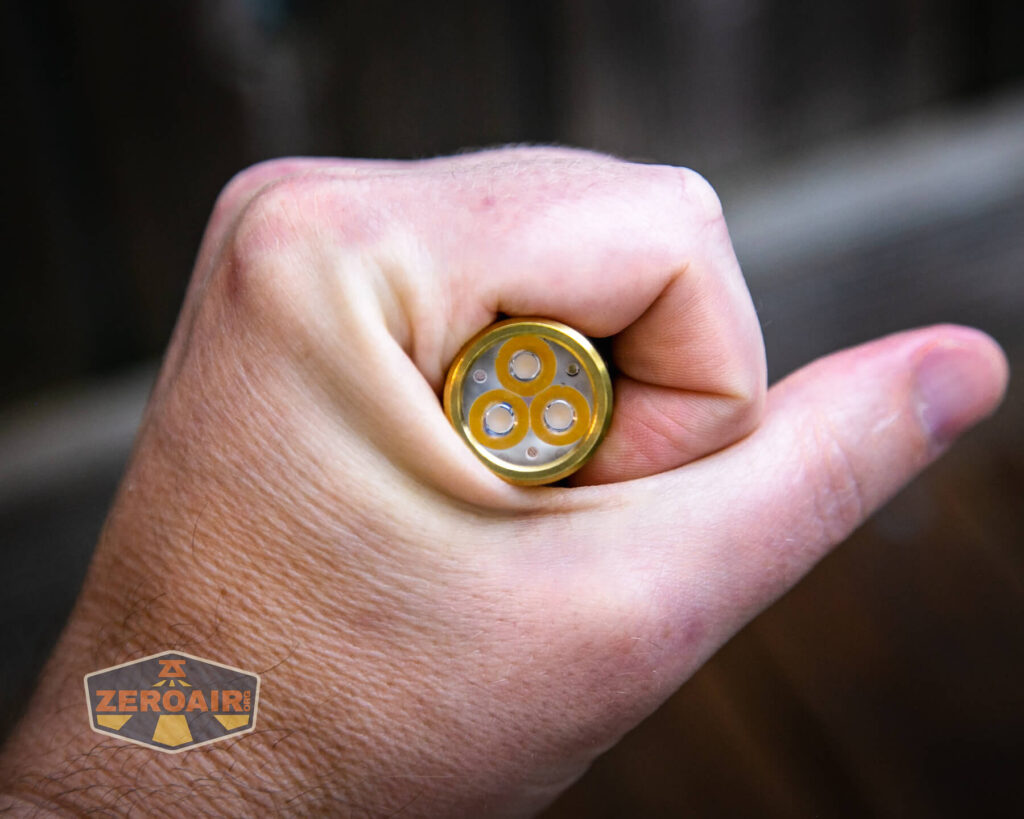 Wurkkos TS10 Brass flashlight in hand