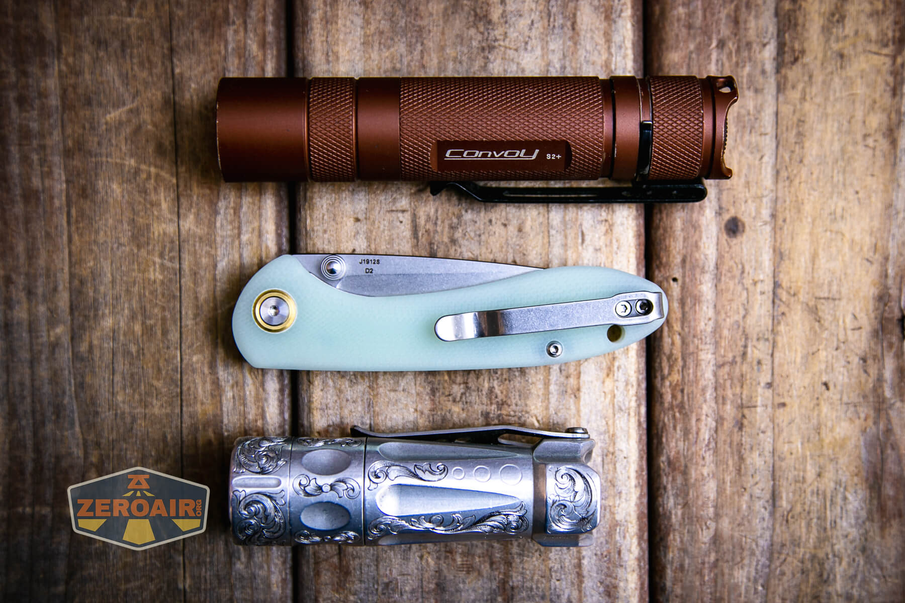 CJRB Feldspar small knife beside standard flashlights