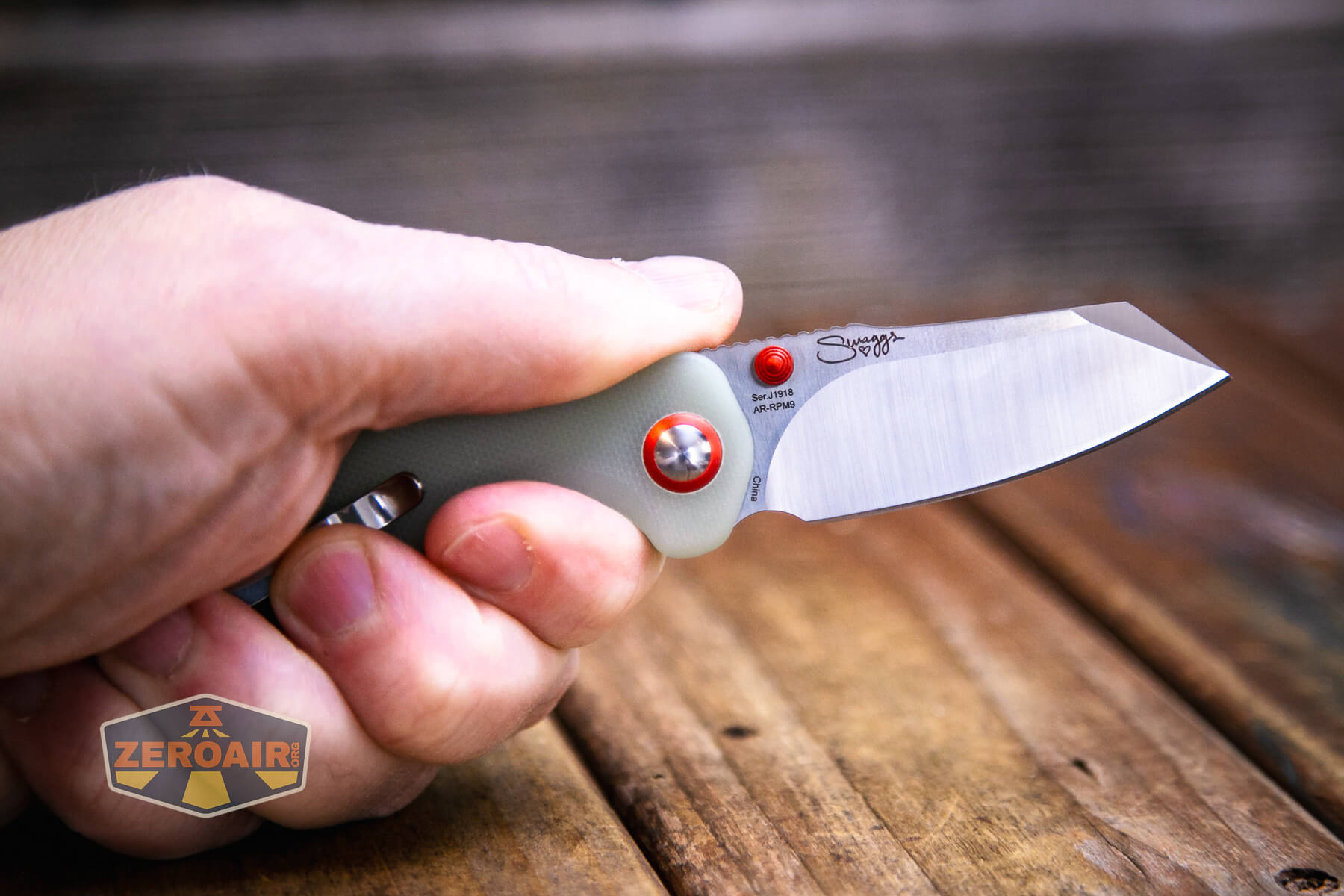 CJRB Maileah J1918 knife open in hand