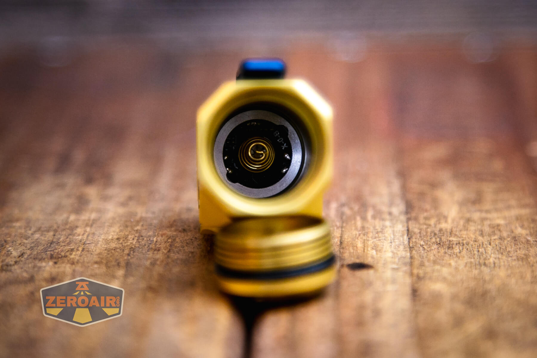 Wuben X-0 Knight brass flashlight showing positive contact