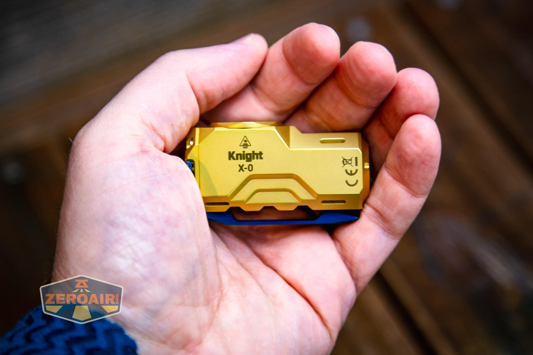 Wuben X-0 Knight brass flashlight in hand