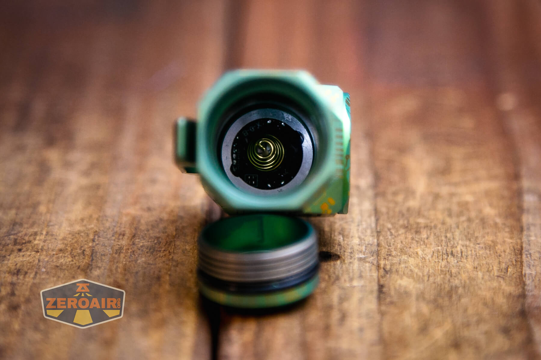Wuben X-0 Knight titanium flashlight showing head spring
