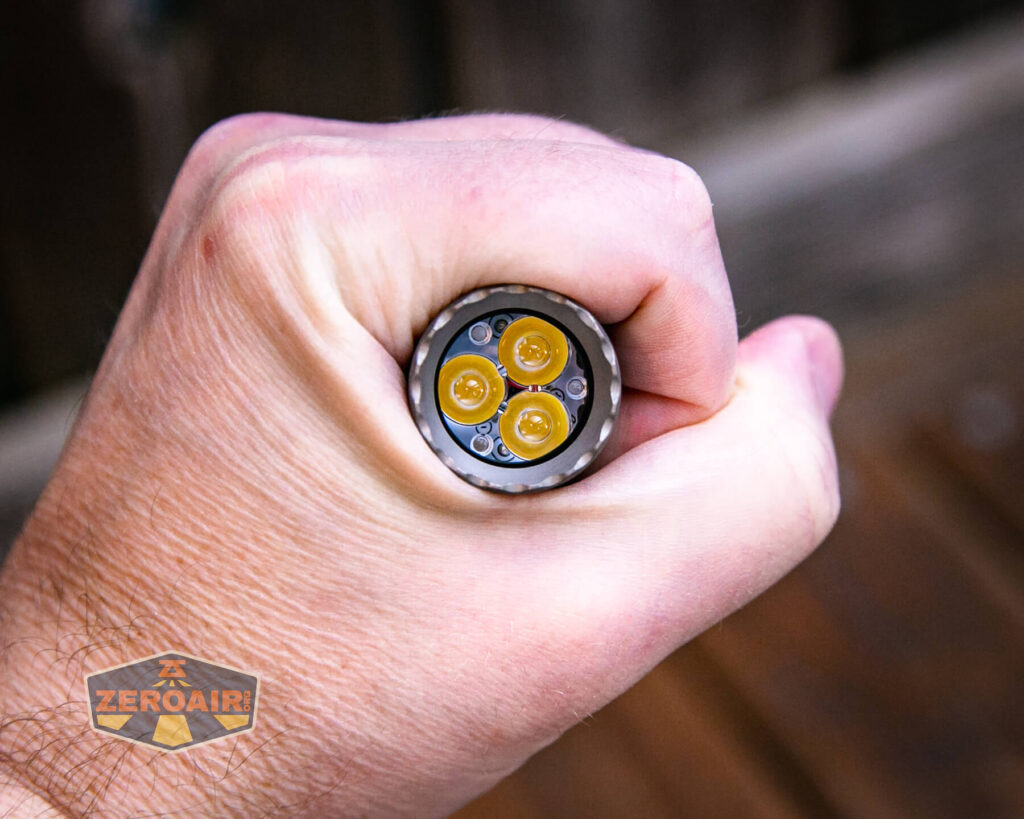 Acebeam E70 Mini Titanium flashlight in hand