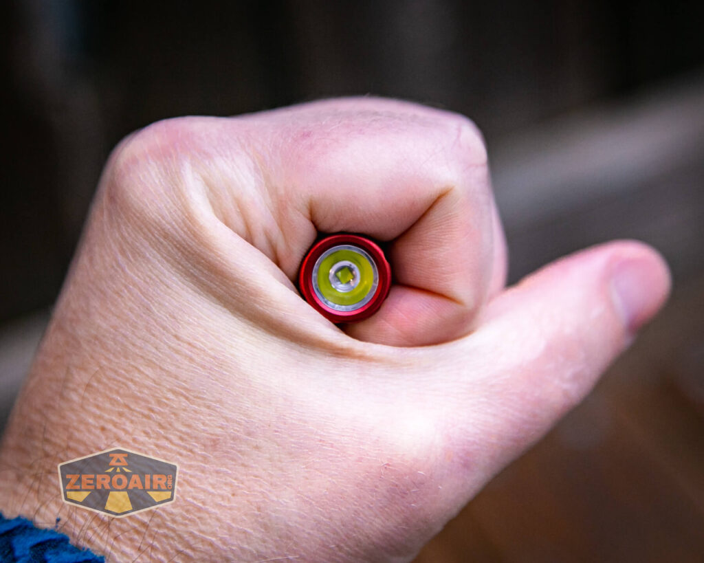 Olight iThx Keychain flashlight in hand