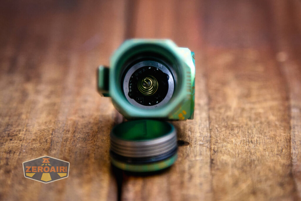 Wuben X-0 Knight titanium flashlight showing head spring