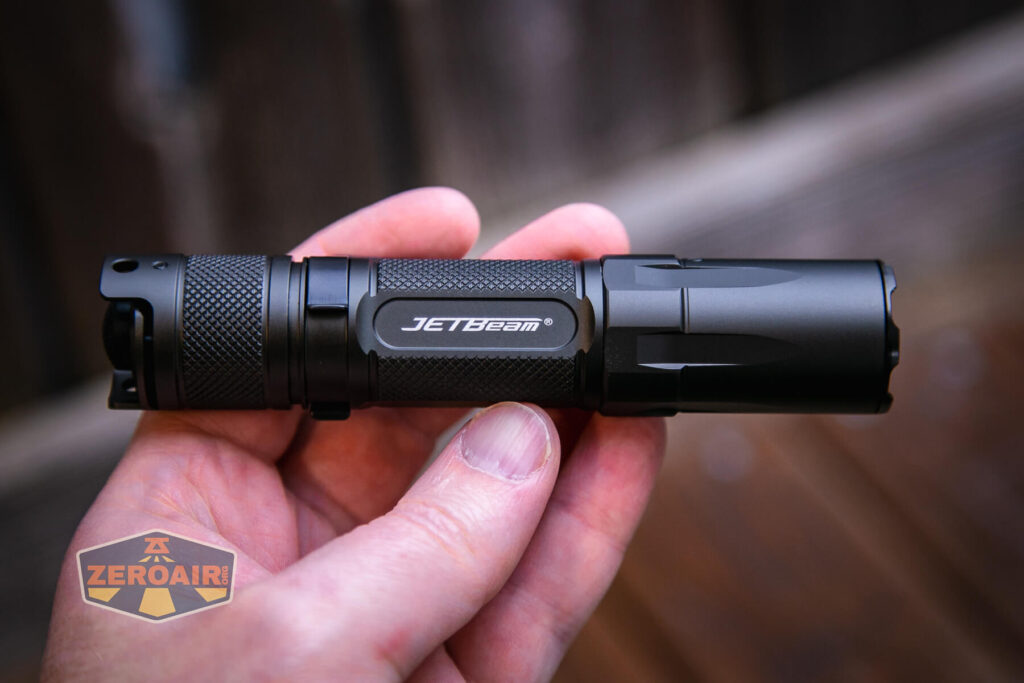 JETBeam TH10R Tactical flashlight in hand