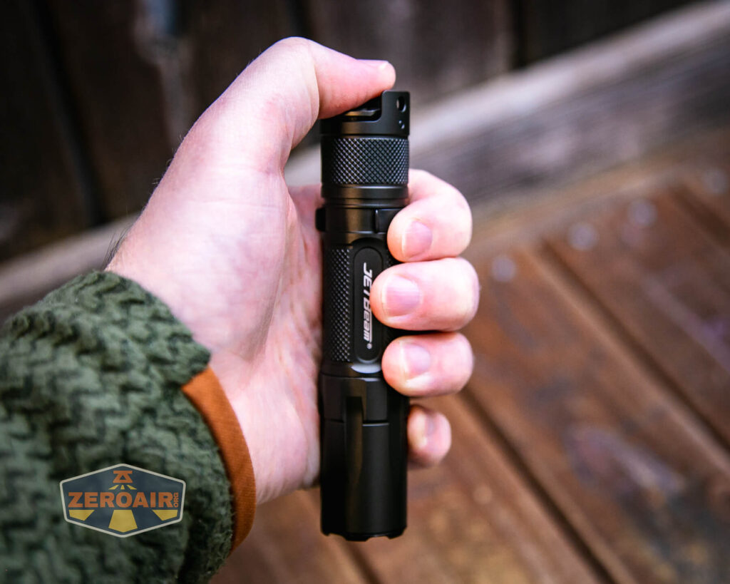 JETBeam TH10R Tactical flashlight in hand