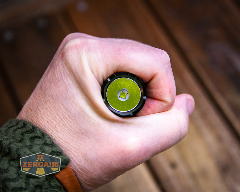 JETBeam TH10R Tactical flashlight in hand