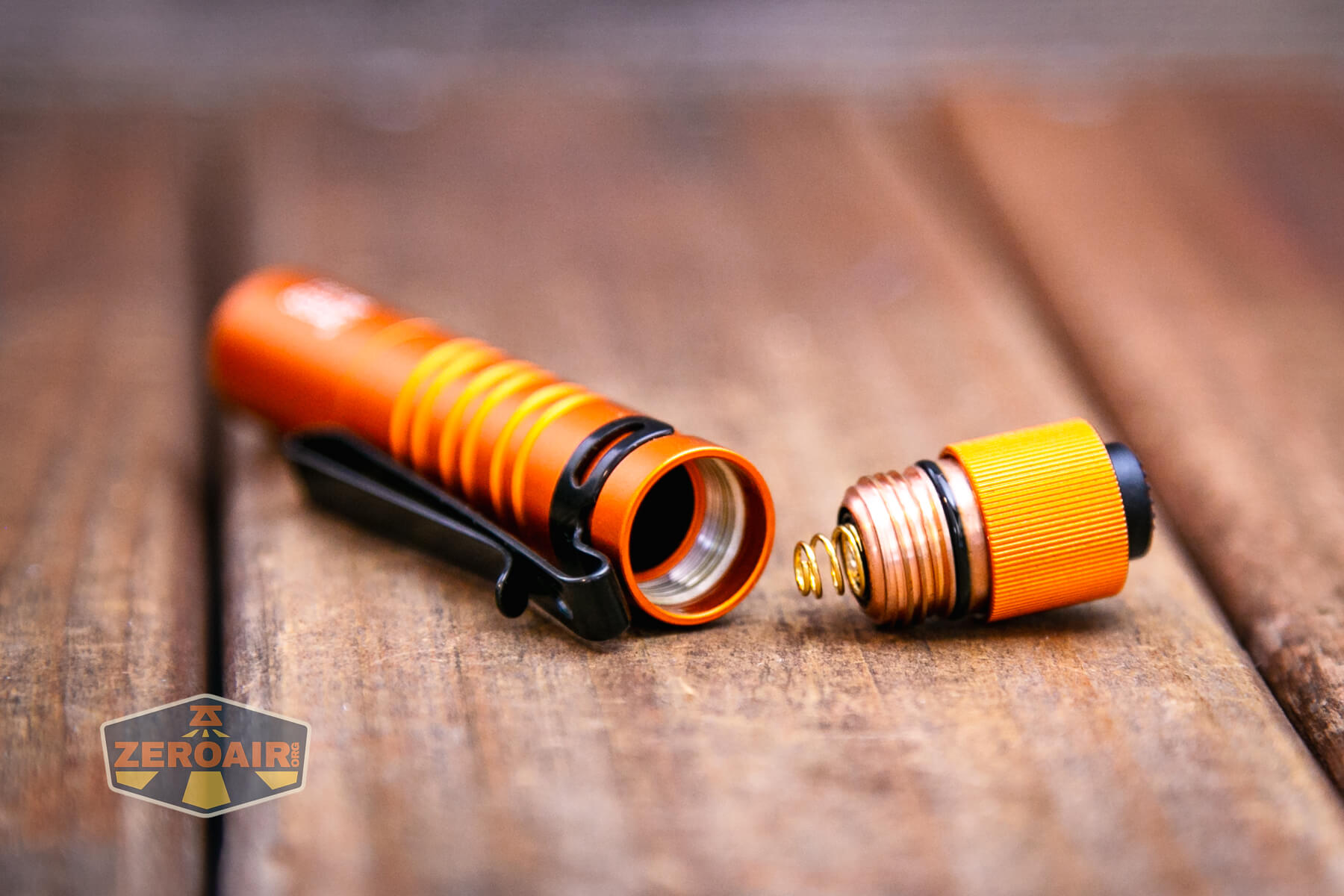 Olight i3T EOS flashlight tailcap off