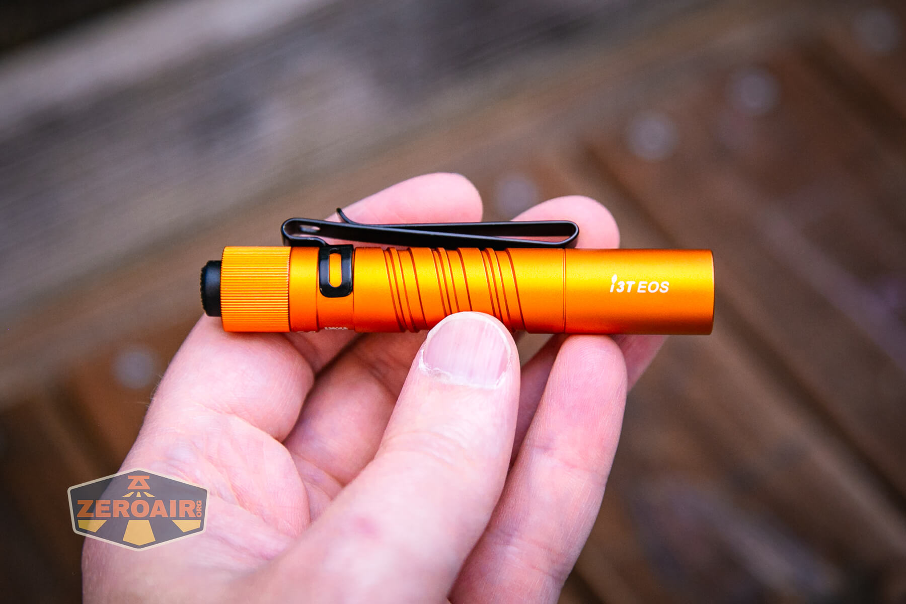 Olight i3T EOS flashlight in hand