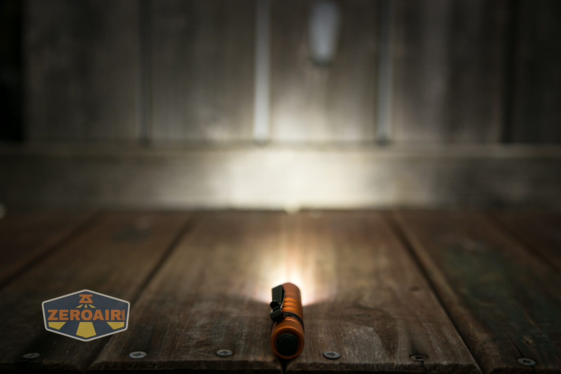 Olight i3T EOS flashlight emitter on