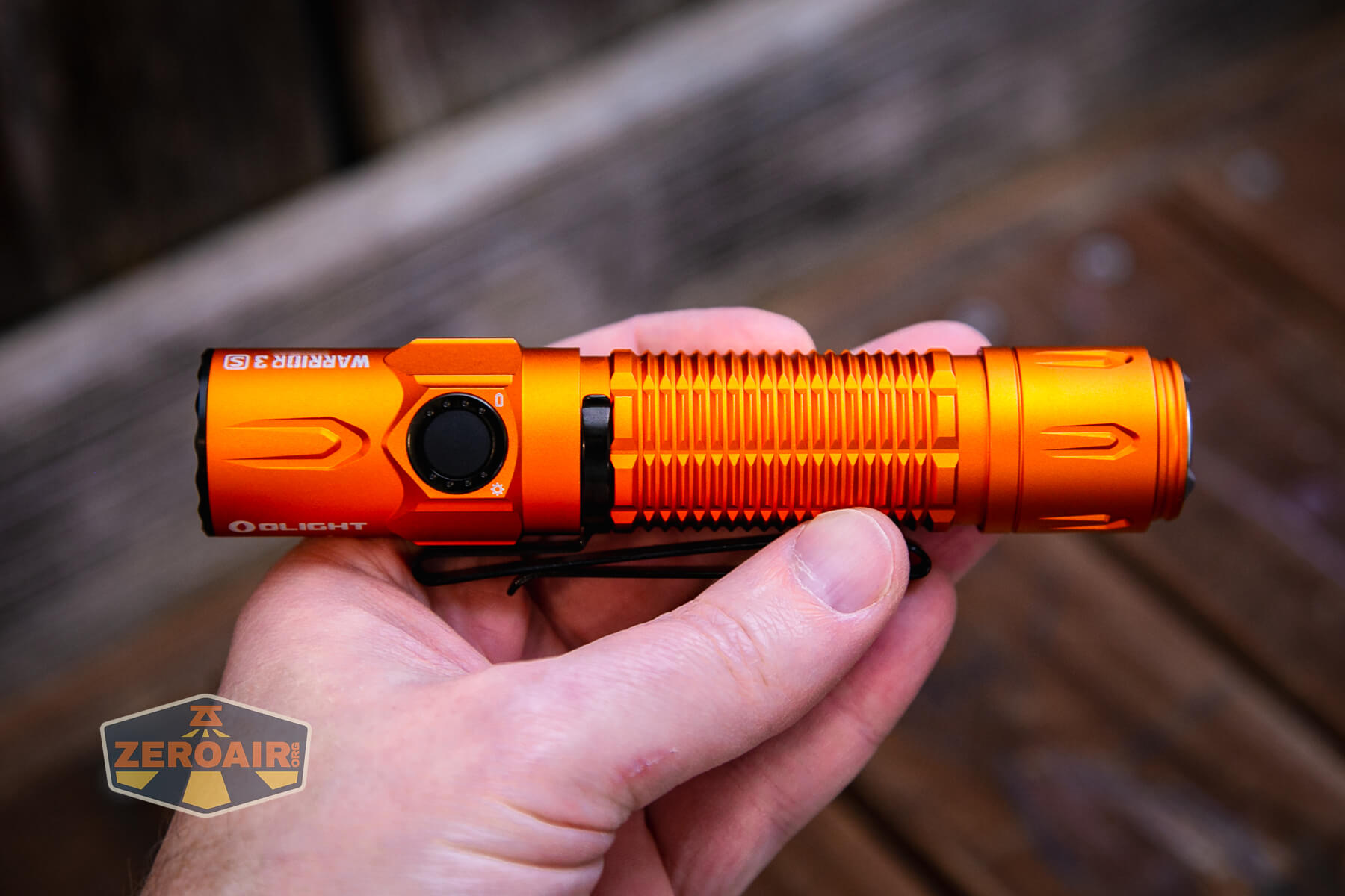 Olight Warrior 3S Orange flashlight in hand
