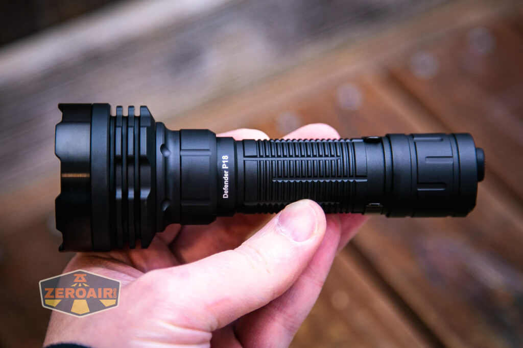 Acebeam Defender P18 tactical flashlight in hand