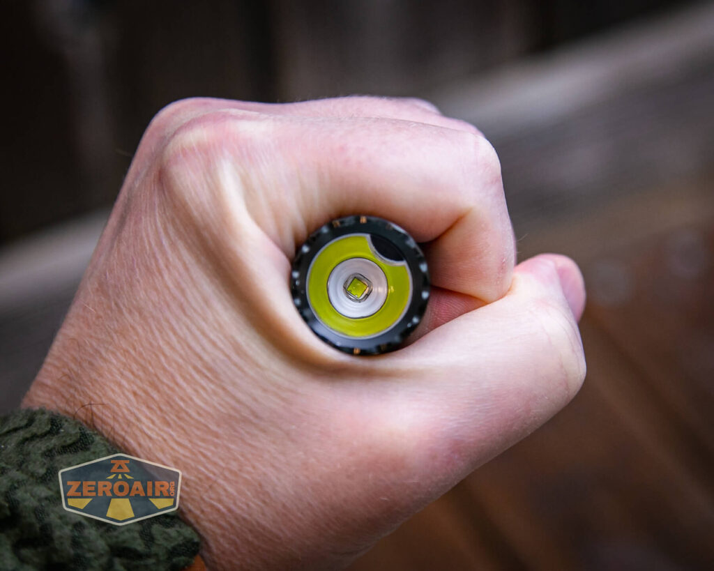 Olight Warrior Mini 2 Black Lava flashlight in hand