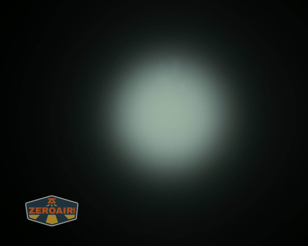 A circular, bright white light beam is shown against a dark background, creating a halo effect. The ZeroAir logo is visible in the lower left corner.