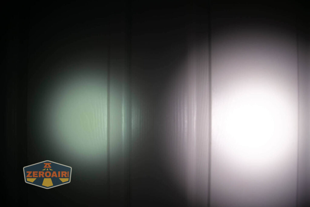 A soft greenish light and a bright white light are cast onto a vertical, ridged surface, creating two overlapping circles of illumination. The ZeroAir logo is in the lower left corner.