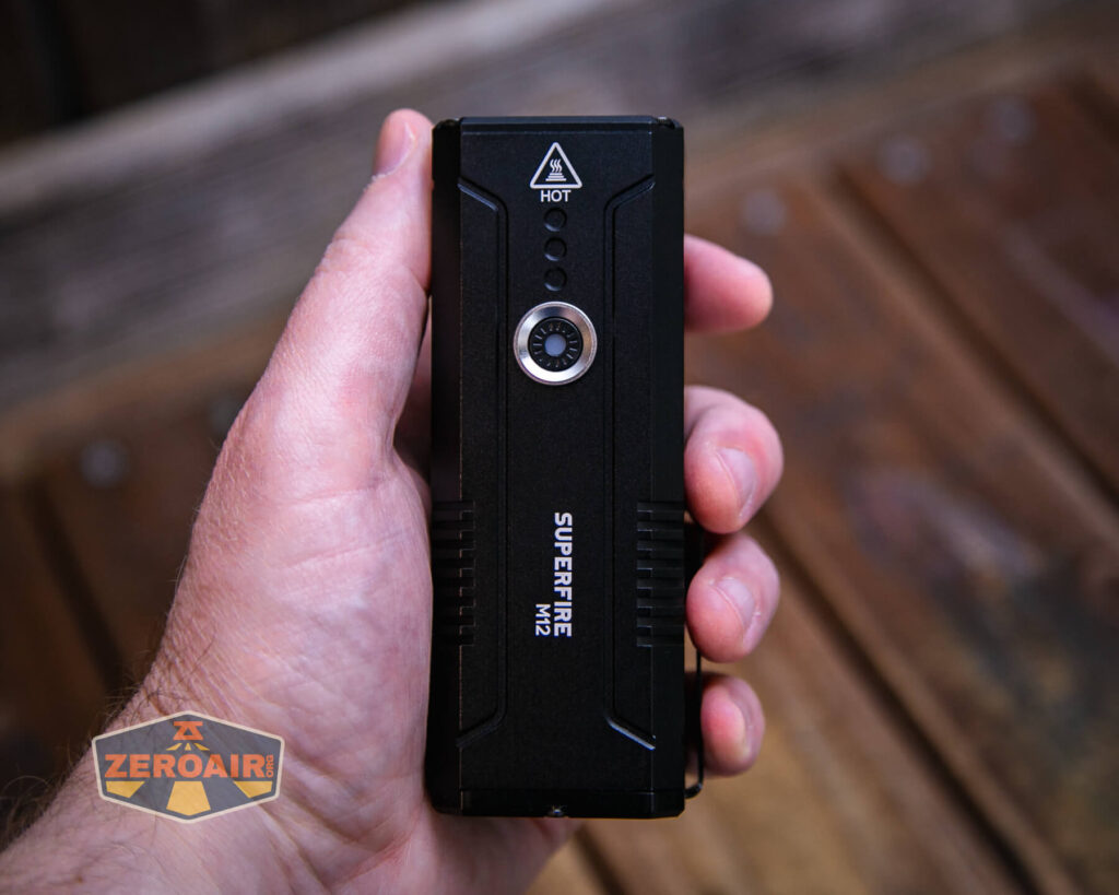 Superfire M12 Rechargeable flashlight in hand