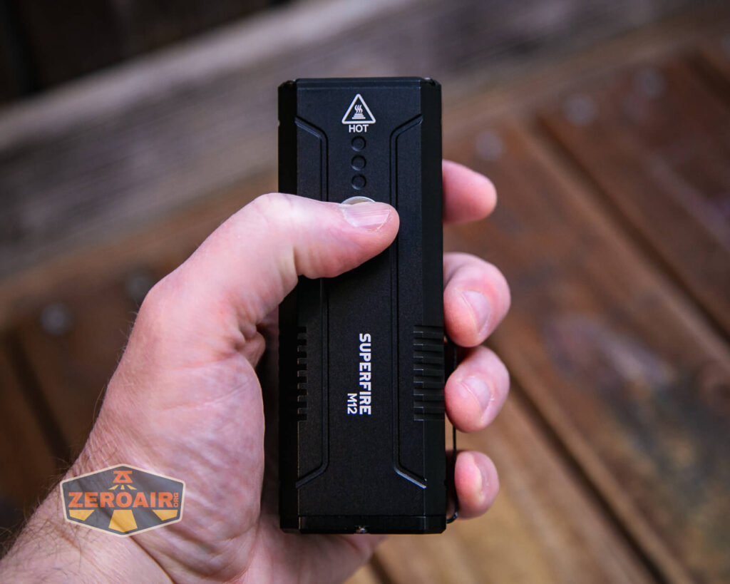 Superfire M12 Rechargeable flashlight in hand