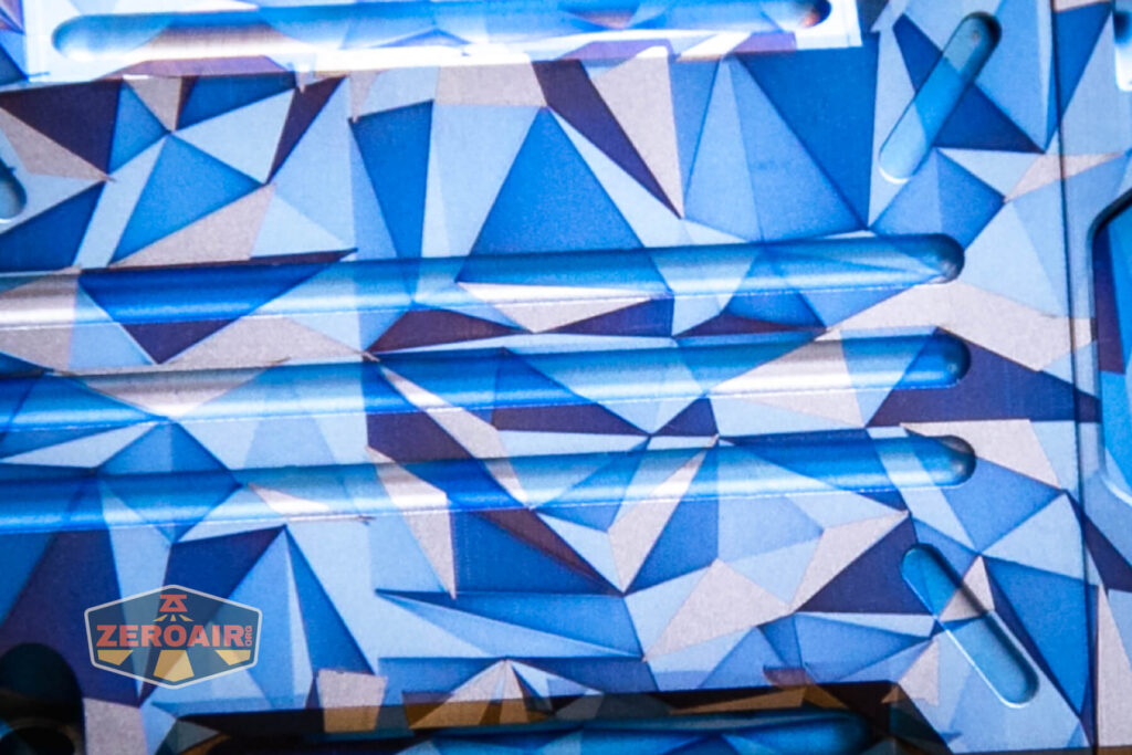 Wuben X-2 Owl Titanium flashlight geometric pattern detail view