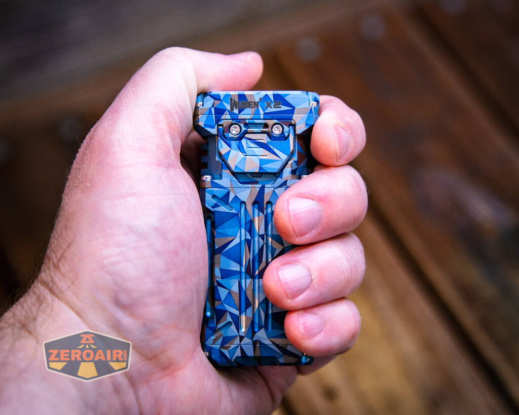 Wuben X-2 Owl Titanium flashlight in hand