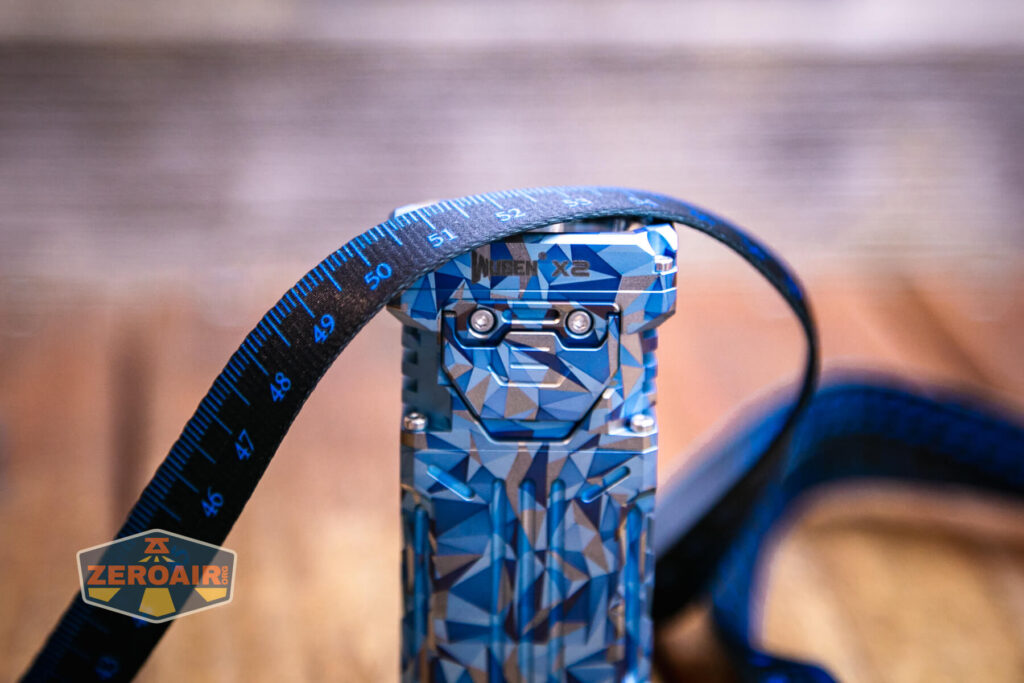 Wuben X-2 Owl Titanium flashlight lanyard ruler detail